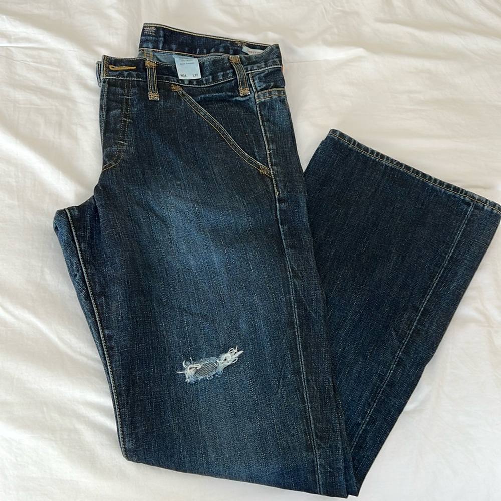 Levi’s premium denim button fly 33X34 dark wash slightly distressed jeans
